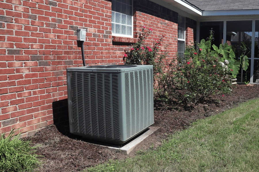 HVAC system outside of a beautiful brick home